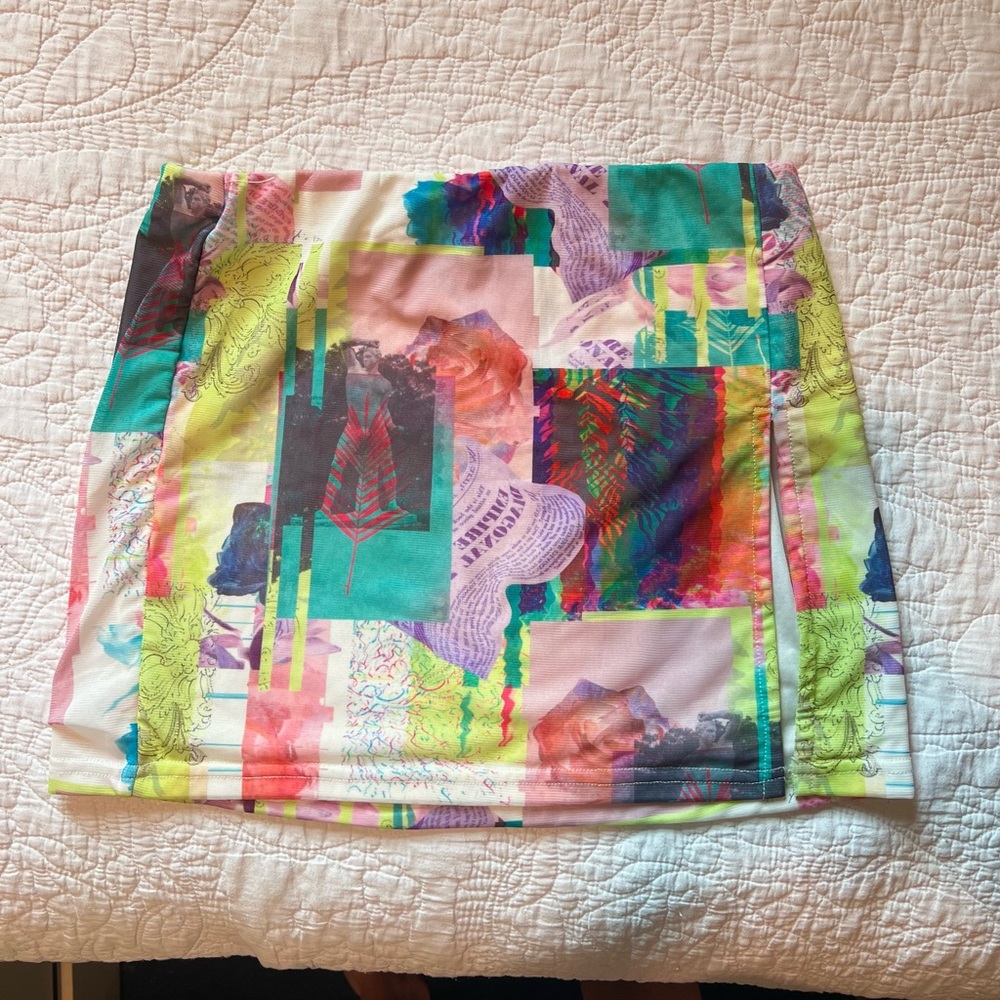 Beginning boutique colorful print mini skirt with slit! Worn twice!